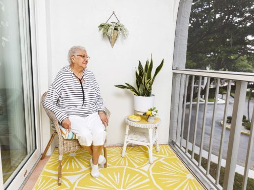 Resident relaxing on balcony